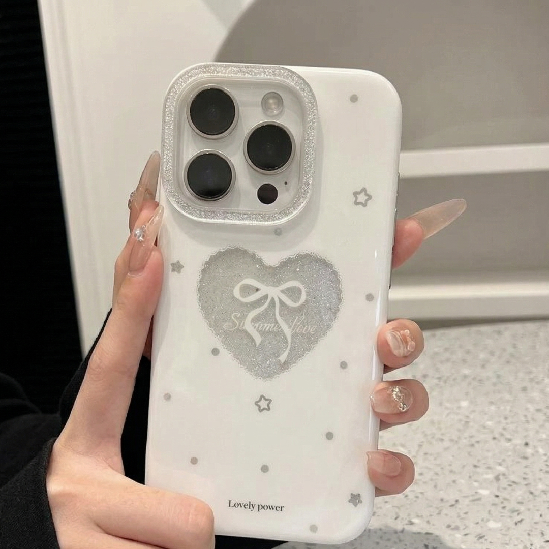 Phone case with heart design held by a person